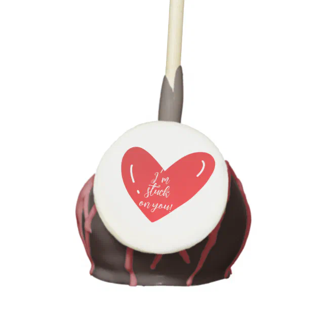 I’m stuck on you message on a red heart shape cake pops