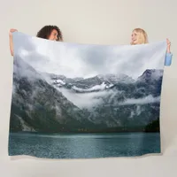 Snowy mountains in the fog at Plansee lake  Fleece Blanket