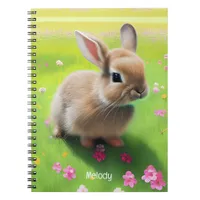 Cute baby rabbit in a flower meadow   notebook