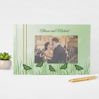 Green butterfly on light green - wedding guest book