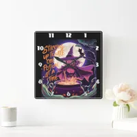 A witch brewing potions under a full moon square wall clock