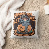 A whimsical witch perched on a pumpkin at dusk throw pillow