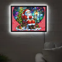 Santa relaxing by the Christmas tree at night LED Sign