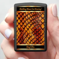 Glistening patterned snake skins in sunlight zippo lighter