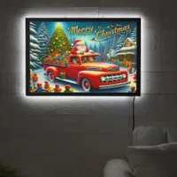 Santa delivers gifts in a snowy winter wonderland LED sign