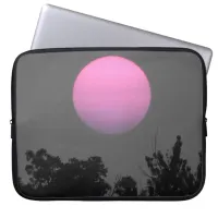 Pink Sun at sunset setting behind Trees Laptop Sleeve