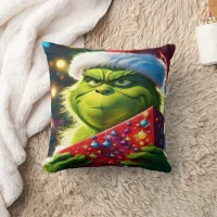 The Grinch holding a colorful present at Christmas Throw Pillow