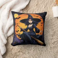 A witch rides her broom beneath a harvest moon throw pillow