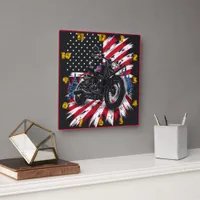 Motorcycle cruising against a patriotic backdrop square wall clock