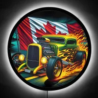 Vibrant hot rod racing past a Canadian flag LED Sign