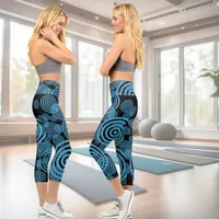 Modern, trendy blue circles on black capri leggings