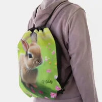 Cute baby rabbit in a flower meadow  drawstring bag