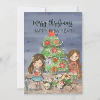 Girls decorating Christmas tree Holiday Card