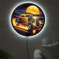 Classic hotrod cruising under a super moon LED sign