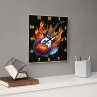 Vibrant guitar surrounded by flames at twilight square wall clock