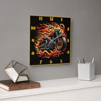 Fiery motorcycle racing through a vibrant sunset square wall clock