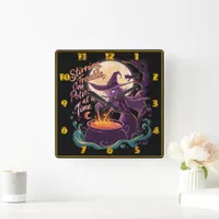 Witch brewing potions under a full moon square wall clock