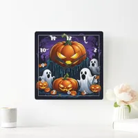 Ghosts gather by glowing pumpkins at night square wall clock