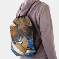 Beautiful Chatty Mandarin Duck on the Rocks Drawstring Bag