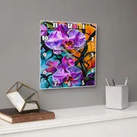 Vibrant Orchid Blooms Against Distinctive Backdrop Square Wall Clock