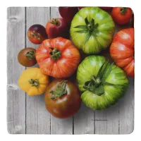 Colorful Striped Tomatoes on Weathered Table Trivet