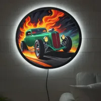 Classic hotrod racing down a fiery road at dusk LED sign