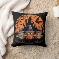 Halloween scarecrow trio beneath an eerie moon throw pillow