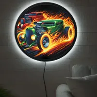 Vintage hot rods racing through flames at twilight LED sign