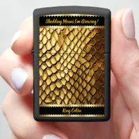 Captivating golden snake skins shimmering in light zippo lighter