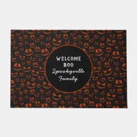 Pumpkin Eyes and Grins in Black Halloween Name Doormat