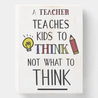 A teacher teaches kids to think not what to think wooden box sign