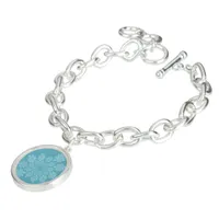 Romantic white fractal ornaments on blue bracelet