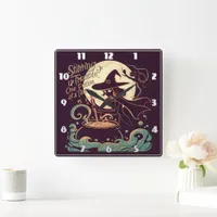 Witch creating potions under a glowing moon square wall clock