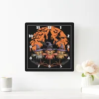 Halloween scarecrow trio beneath an eerie moon square wall clock