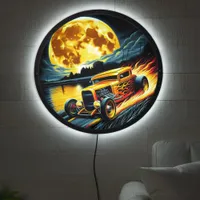 Hotrod racing under a full moon by the river LED sign