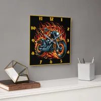 Fiery motorcycle blazing through a cosmic backdrop square wall clock