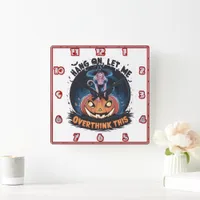 Witch perched on a pumpkin in a night sky square wall clock