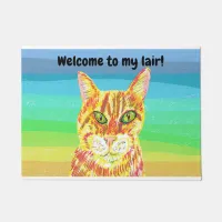 Brightly colored ginger cat welcome to my lair doormat