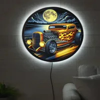 Vintage hotrod racing under a full moon LED sign