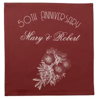 Flourished 50th anniversary in burgundy and white cloth napkin