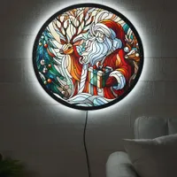 Santa, reindeer, and gifts by trees' LED sign