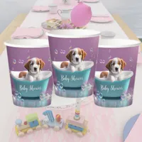 Cute puppy in a bathtub with soap bubbles paper cups