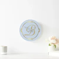 Monogram in gold with infinity circle on Blue | Round Clock