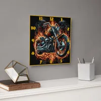 Bold motorcycle engulfed in vibrant flames at dusk square wall clock