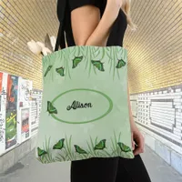 Green butterfly on light green  - customizable  tote bag