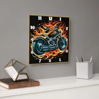 Fiery motorcycle roaring through the night sky square wall clock