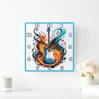 A fiery blue guitar surrounded by swirling flames square wall clock