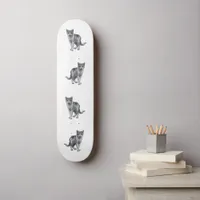 Grey kitten skateboard