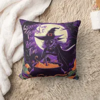 A witch brews potions under a full moon at night throw pillow