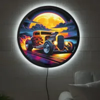 Vibrant hotrod cruising under a full moon at dusk LED sign